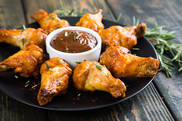 Fried chicken wings with spicy sauce