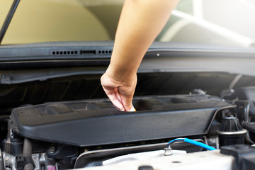 Mechanic changing oil mechanic car with open hood
