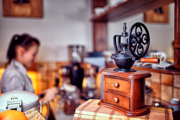 Espresso coffee with old coffee grinder .