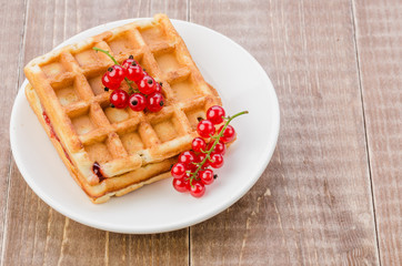 wafers with red berries/wafers with red berries. Top view. With copy space