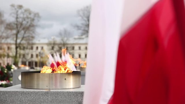 Znicz and the flag of the Polish state.
