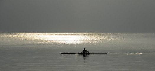Rower man on annecy lake © fullempty