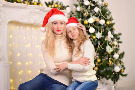 Portrait of mother and daughter New Year Christmas