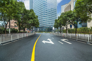 city road through modern buildings in beijing.