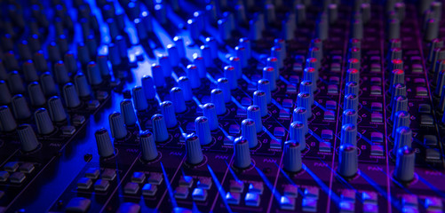 Sound music mixer control panel on colourful light