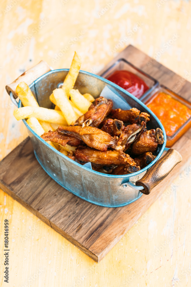 Wall mural fried chicken wing with french fries