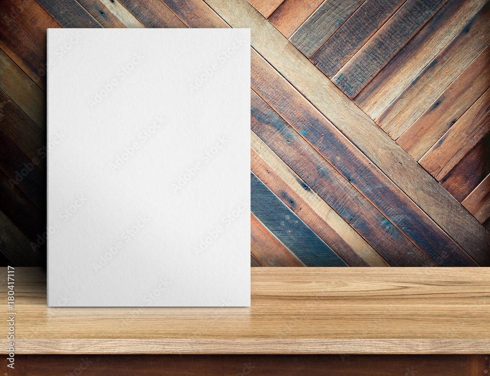 Leinwandbilder Blank White paper poster on wooden table at diagonal wood plank wall,Template mock up for adding your design and leave space beside frame for adding more text..