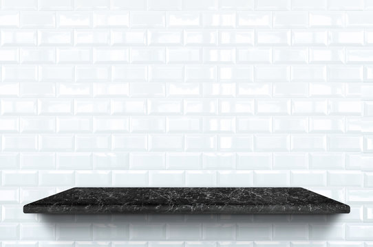 Empty black marble shelf at white ceramic tile wall pattern background,Mock up for display or montage of product or design.