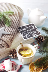 Hot green tea with lemon on a wooden table