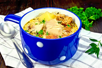 Soup fish with vegetables and herbs on napkin