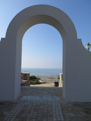 View through Arch on sunny day on Italian coast