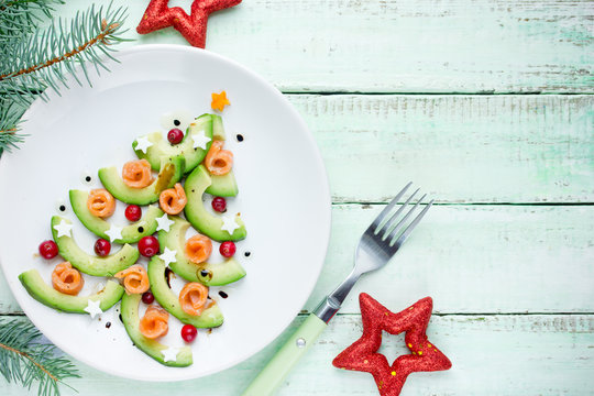 Healthy Christmas appetizer snack - avocado salmon cranberry Christmas tree