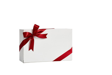 The white box wrapped with red ribbon with a bow