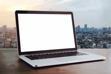 Laptop on table in office room background, for graphics display montage. Take your screen to put on advertising.