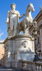 Fototapeta na wymiar Statue of Pollux with his horse at Piazza del Campidoglio on Capitoline Hill, Rome, Italy