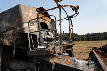 Fototapeta premium Combine harvester destroyed by fire