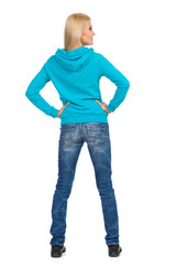 Fototapeta premium Rear View Of Woman In Jeans And Turquoise Hoodie