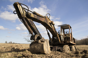 The image of the tractor stuck in the mud