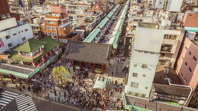 People walking around Nakamise Shopping Street in Asakusa, Tokyo, Japan. Time lapse from high angle