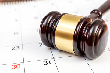 Judge's gavel on the calendar.