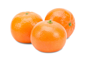 Three ripe mandarins on a white background