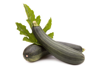Two ripe zucchini on white background