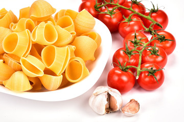 Preparation of pasta. Ingredients for cooking pasta on white background. Traditional Italian cuisine.