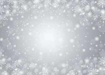 Christmas winter abstract background with snowflakes, bokeh lights and place for text. Christmas New Year's wallpaper