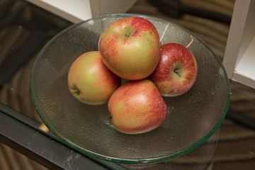 Red apples in the pot. Fresh raw organic fruit.