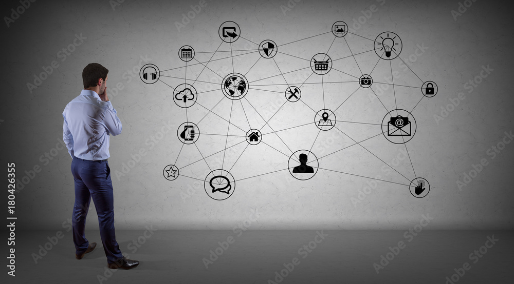 Poster Businessman using social network interface on a wall 3D rendering