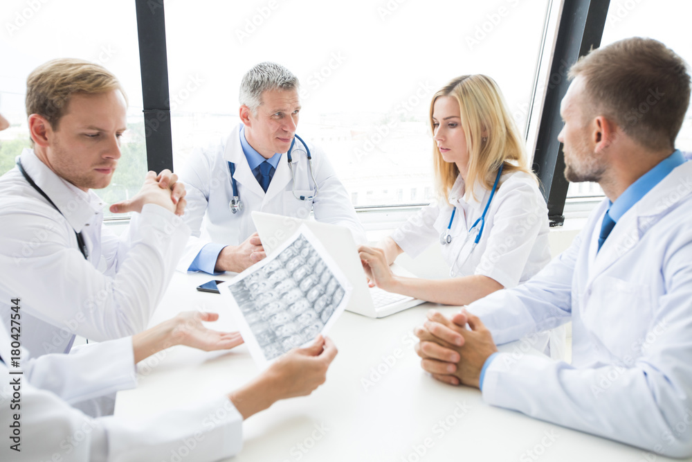 Wall mural Group of medics with x-ray scan