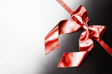 Red ribbon bow on metal