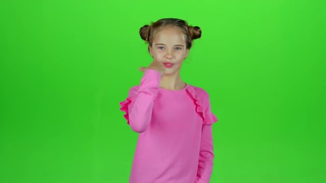 Little girl rejoices in victory. Green screen. Slow motion