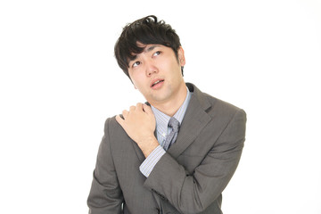 疲れた表情のビジネスマン