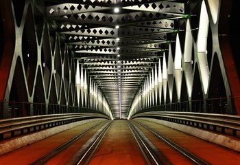metal tram bridge in the night - 180429326