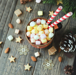 cup of Christmas hot cocoa with marshmallow, top view, selective focus