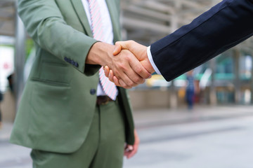 Businessman shaking hands with partner. Concept of deal successful and negotiation agreement.