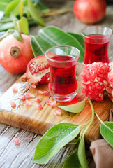Fresh pomegranates and juice, selective focus