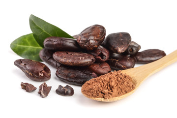 peeled cocoa bean with leaf and cocoa powder in wooden spoon isolated on white background