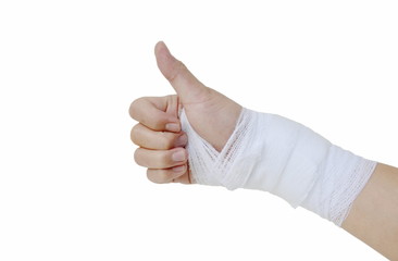 hand with bandage after surgery thumb up on white background