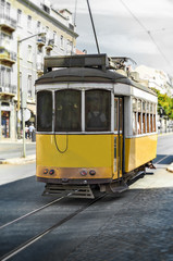 Naklejka na ściany i meble Famous Lisbon tram on the street.