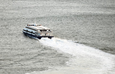 Fototapeta premium Passenger ferry sailing along the river.