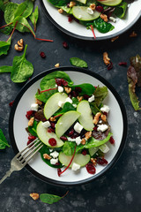 Homemade Autumn Apple Cranberry Salad with walnut, feta cheese and vegetables