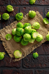 fresh raw brussels sprouts on a old stone rustic table