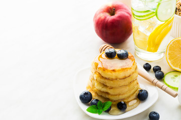 Homemade pancakes with honey and blueberry
