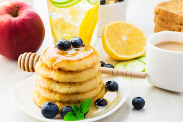 Pancakes with honey and fresh berries, healthy breakfast