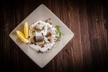 Marinated herring fillets in cream