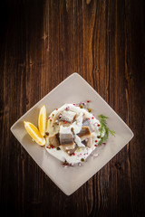 Marinated herring fillets in cream