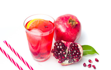 Pomegranate fruit and juice isolated on white