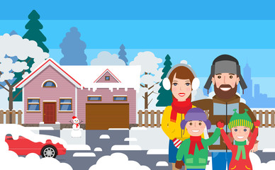 happy family standing outside house cottage in winter clothes